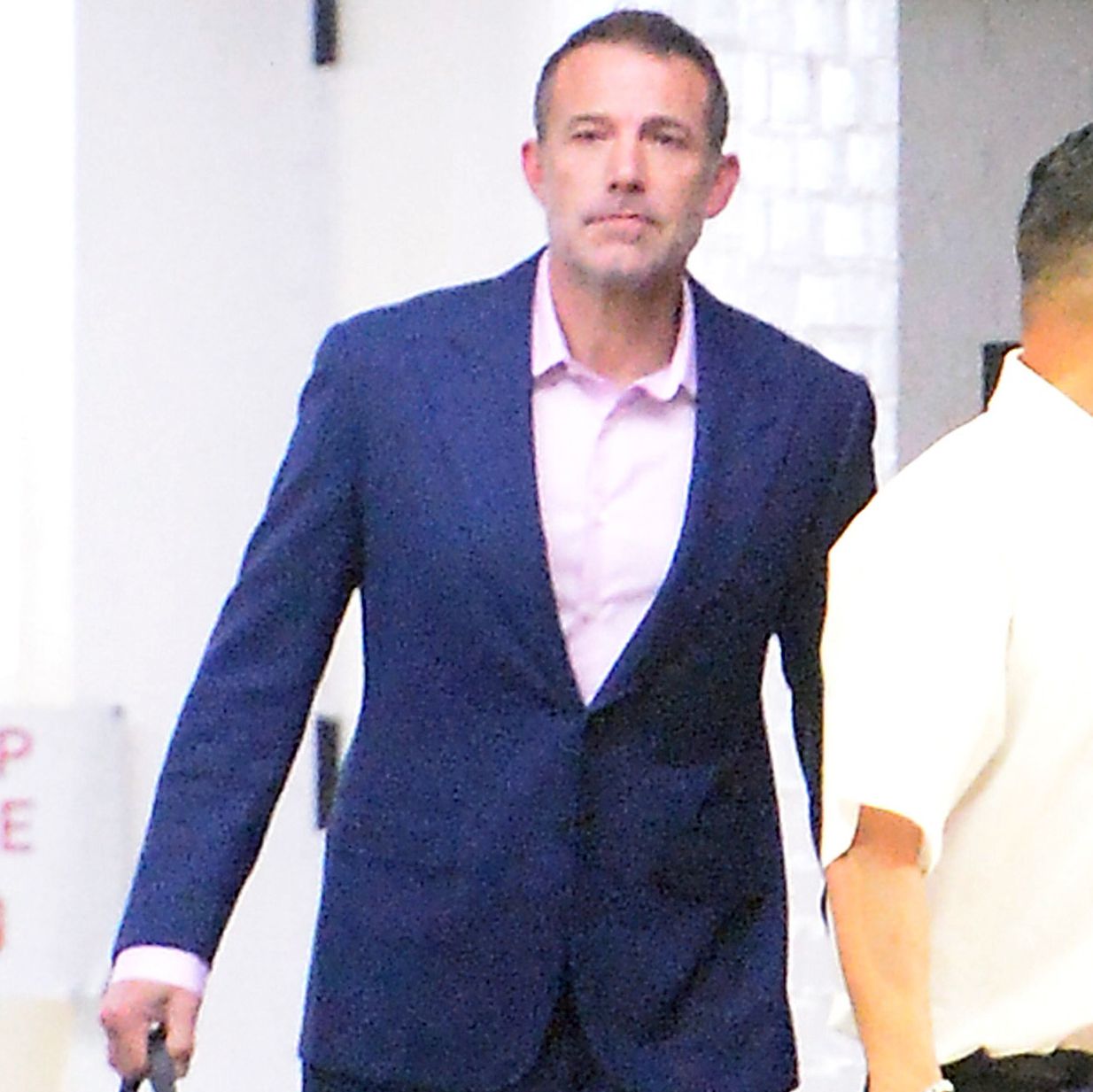 Ben Affleck is spotted as he heads to his office in Los Angeles. Affleck flashed a smile and looked dapper in a blue suit amid his recent 