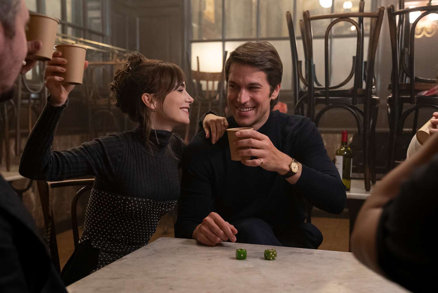 Emily in Paris. (L to R) Lily Collins as Emily, Lucas Bravo as Gabriel in Emily in Paris