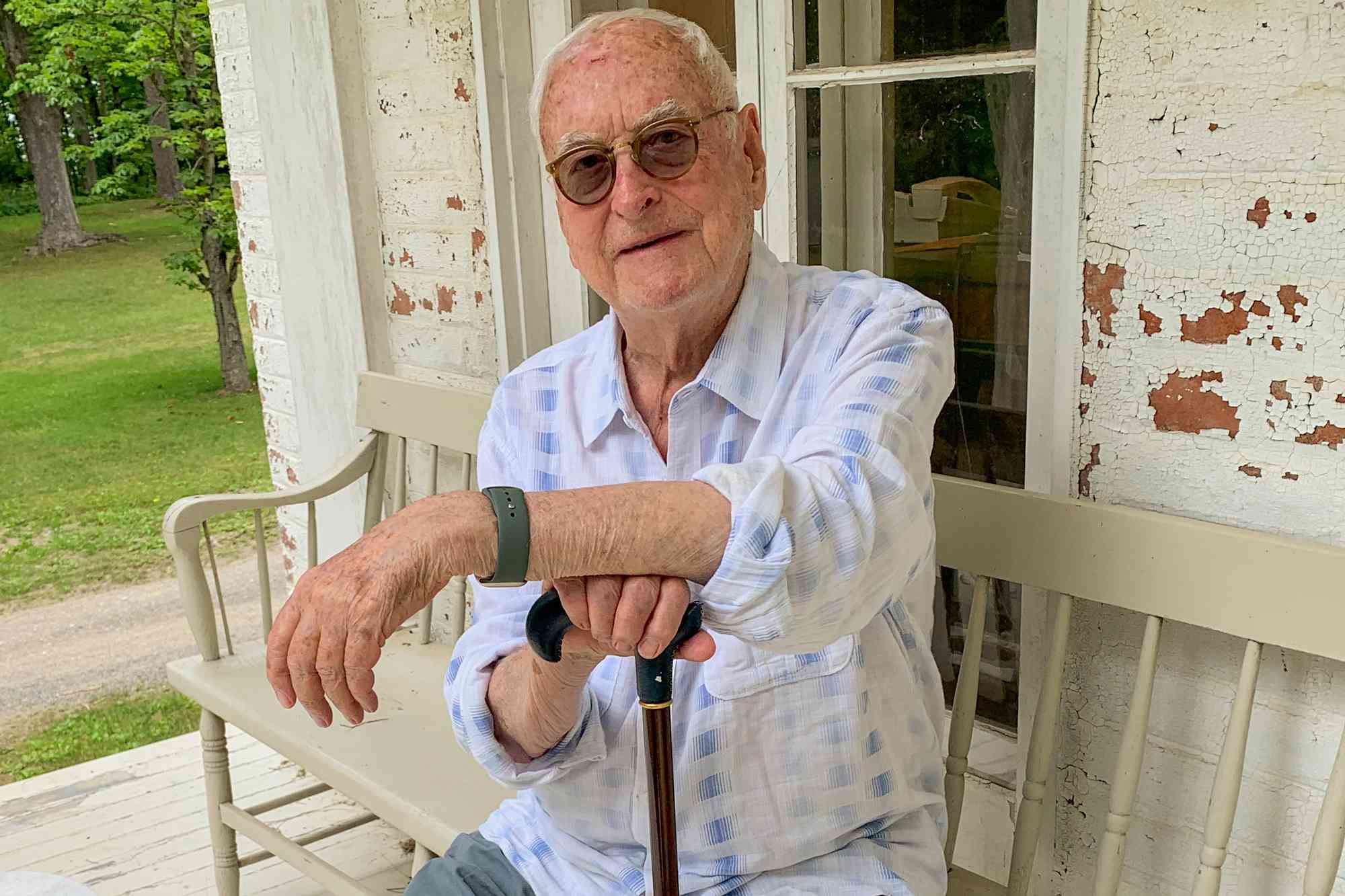 Portrait of American film director James Ivory as he sits on the porch at his home, Claverack, New York, June 23, 2023. 