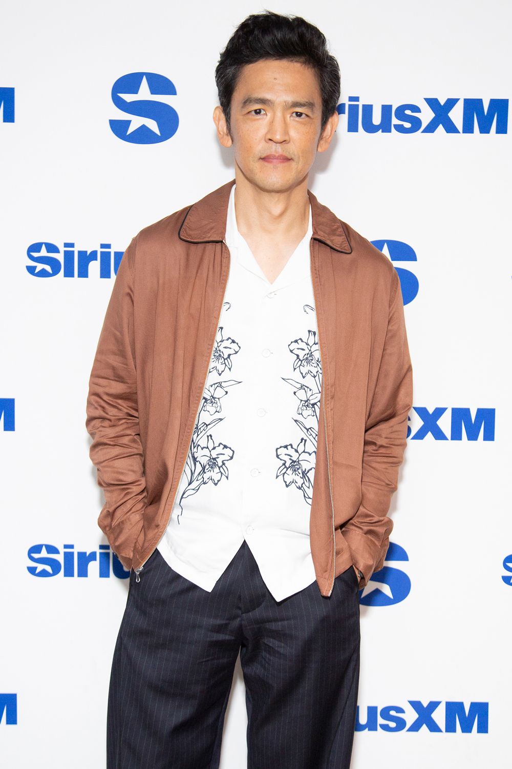 John Cho visits SiriusXM Studios on August 27, 2024 in New York City