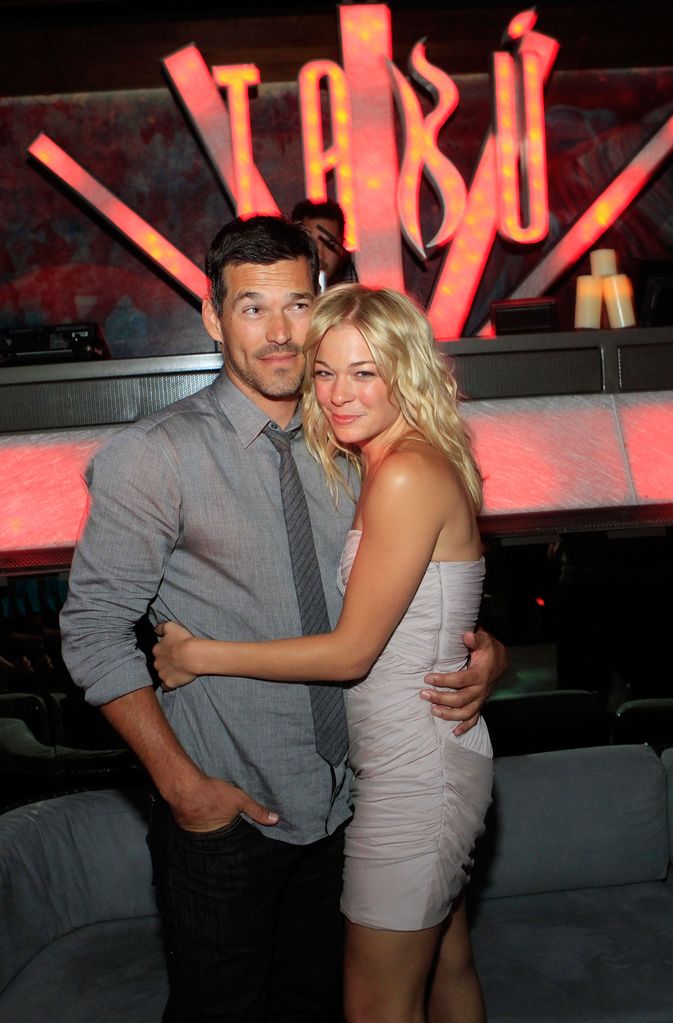 LeAnn Rimes with her arms around Eddie Cibrian