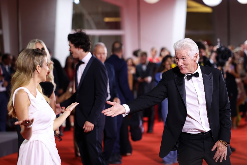 Alejandra Silva and Richard Gere attends the Filming Italy Venice Award red carpet during the 81st Venice International Film Festival on September 01, 2024 in Venice, Italy.