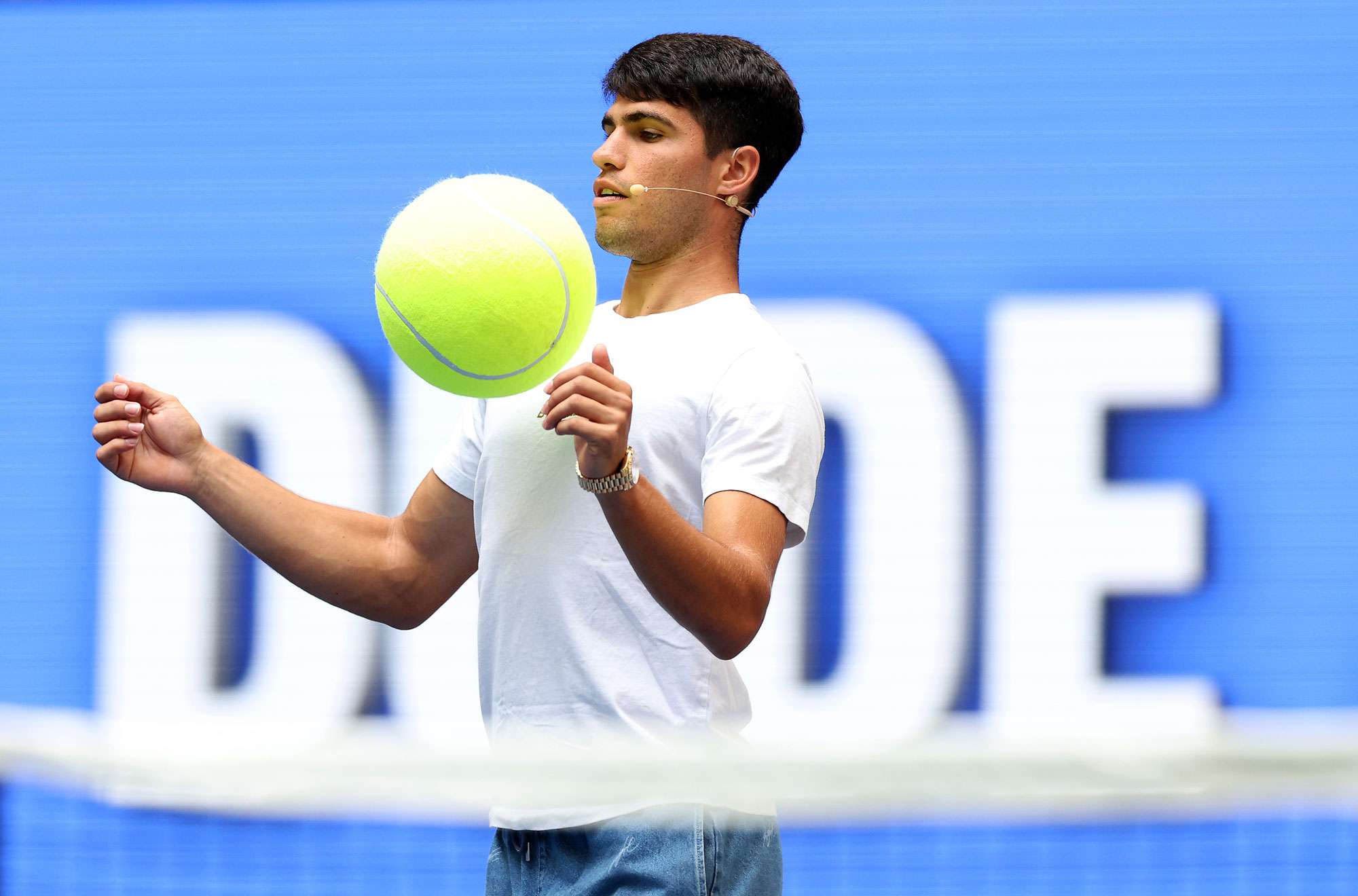  Carlos Alcaraz of Spain plays soccer with a giant tennis ball with members of Dude Perfect during Arthur Ashe Kid's Day ahead of the US Open at USTA Billie Jean King National Tennis Center on August 24, 2024