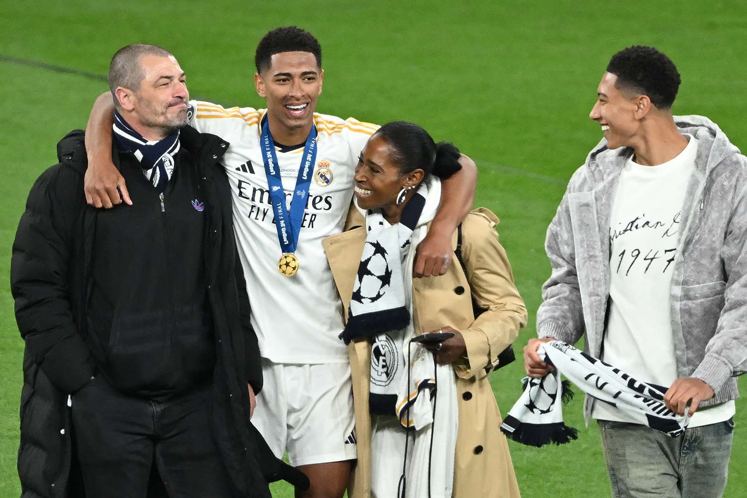 Real Madrid's English midfielder #05 Jude Bellingham celebrates with his mother Denise, his father Mark and his brother Jobe after the UEFA Champions League final football match between Borussia Dortmund and Real Madrid, at Wembley stadium, in London, on June 1, 2024. 