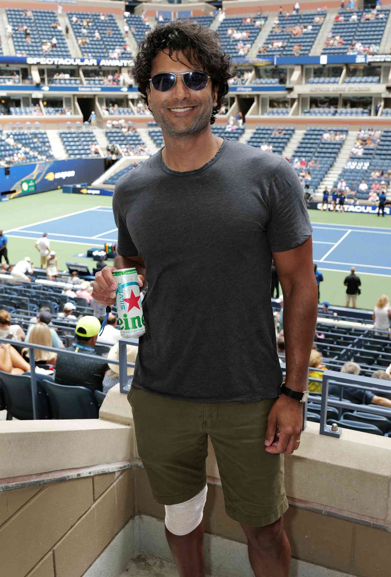 Sendhil Ramamurthy enjoys a Heineken Silver at the Heineken Suite of the US Open at the USTA Billie Jean King National Tennis Center on August 28, 2024. 