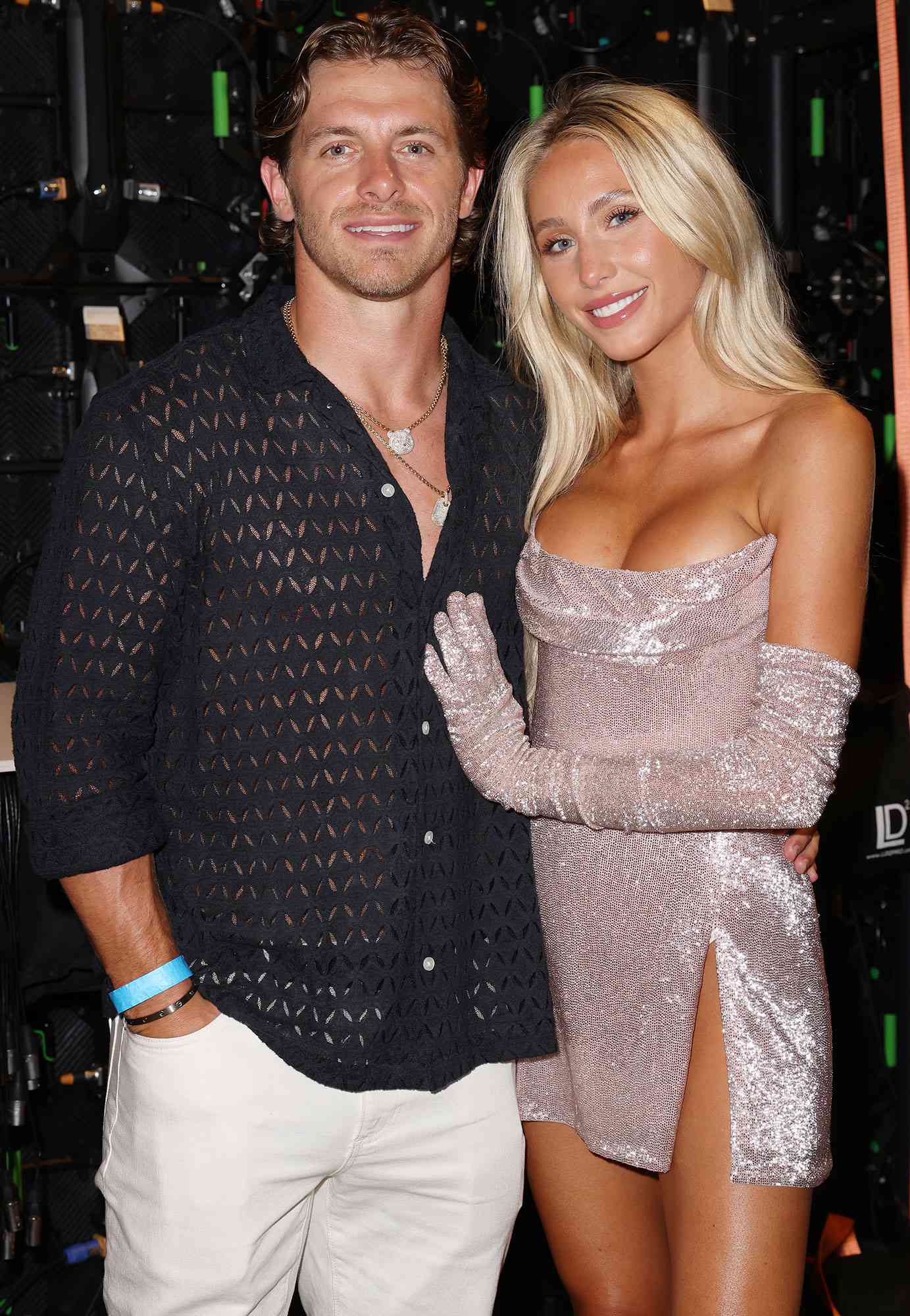 Braxton Berrios and Alix Earle pose backstage at the Sports Illustrated Swimsuit Runway Show During Miami Swim Week on June 01, 2024.