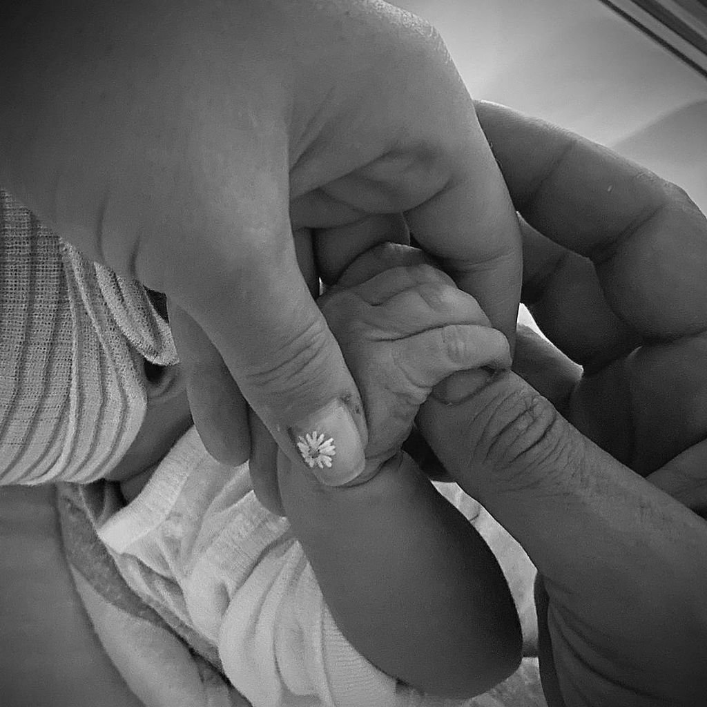 Katy Perry and Orlando Bloom hold their newborn daughter Daisy Dove Bloom, shared on Instagram in collaboration with UNICEF