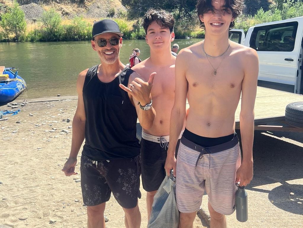 Eddie cibrian with tall sons by lake