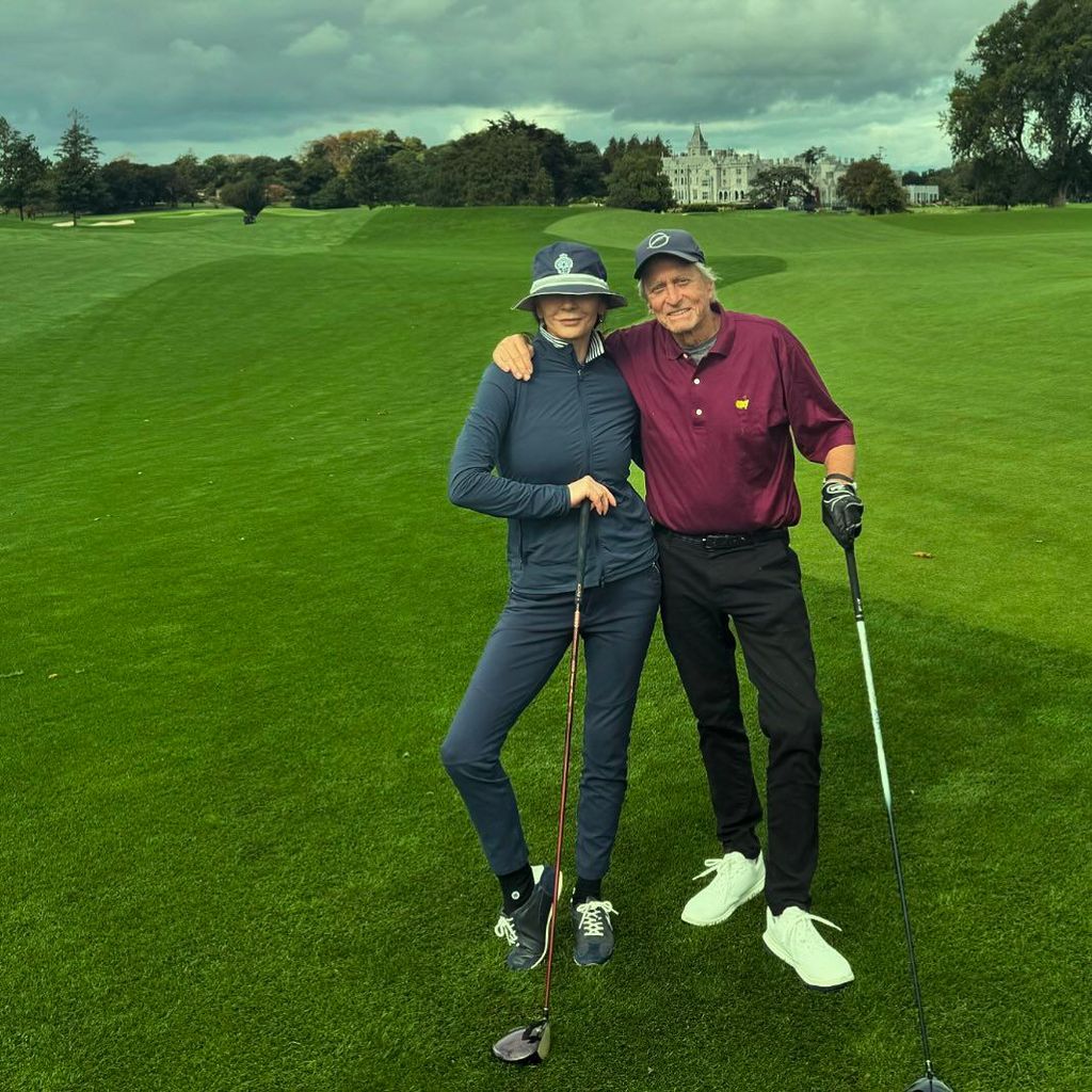 couple posing on golf course