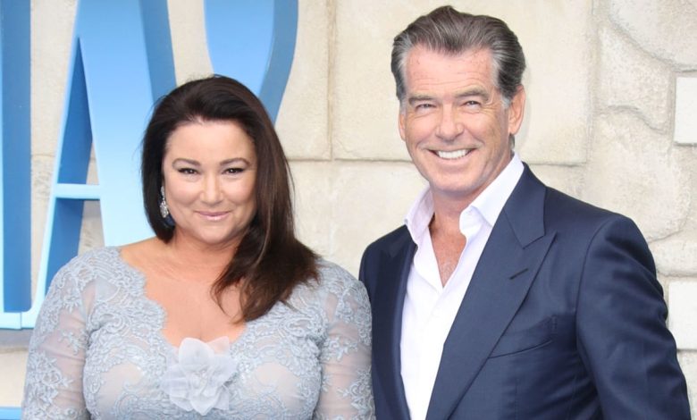 Pierce Brosnan's wife wows in all white as she's reunited with 007 star