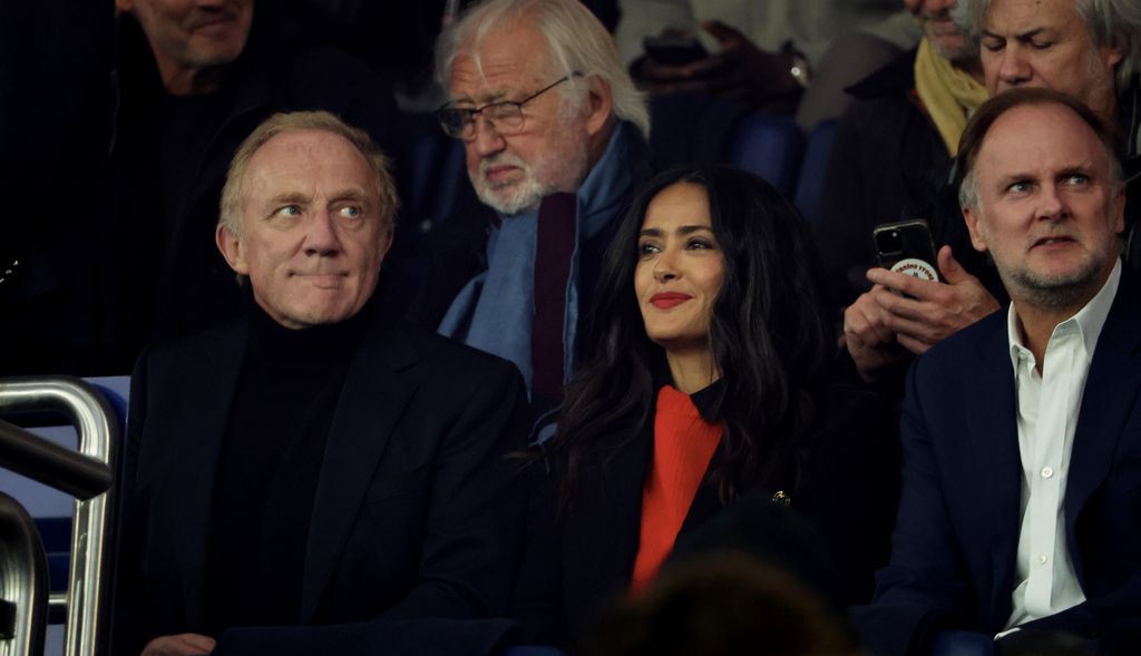  Francois-Henri Pinault and his wife, Salma Hayek react during the Ligue 1 McDonald's match between Paris Saint-Germain and Stade Rennais at Parc des Princes on September 27, 2024 in Paris, France