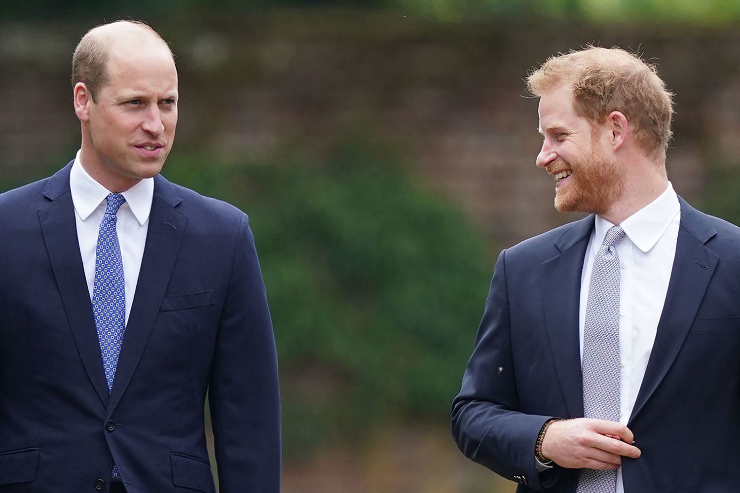 Prince William, Duke of Cambridge, (L) and Britain's Prince Harry, Duke of Sussex, arrive for the unveiling of a statue of their mother, Princess Diana at The Sunken Garden in Kensington Palace