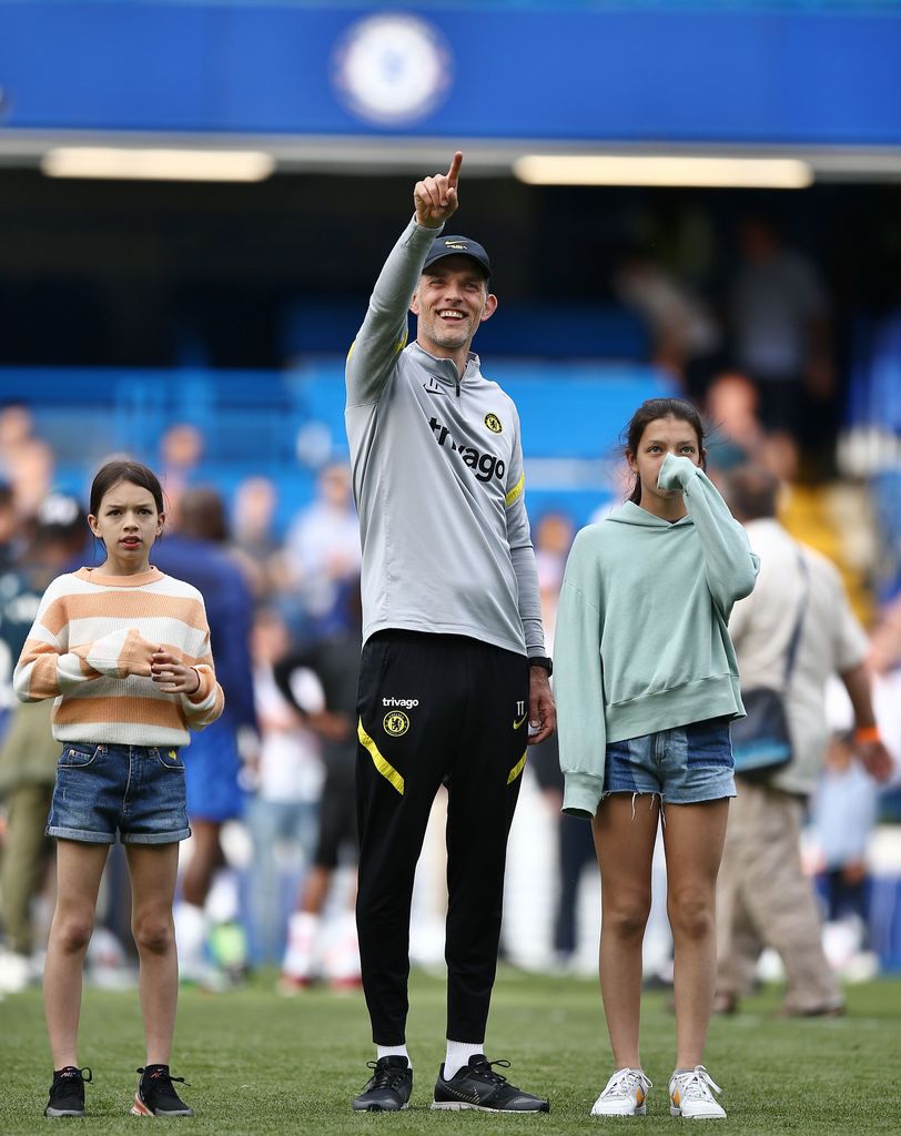 Thomas Tuchel on a football field with his two daughters