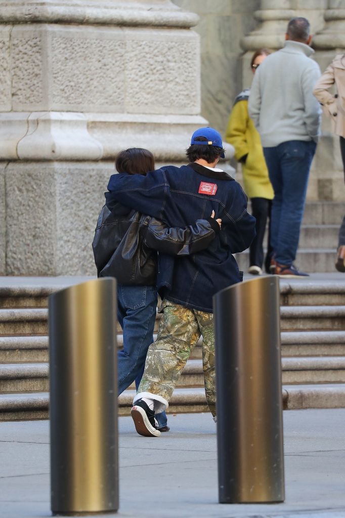 Cruz Beckham kept his arm around Jackie Apostel 