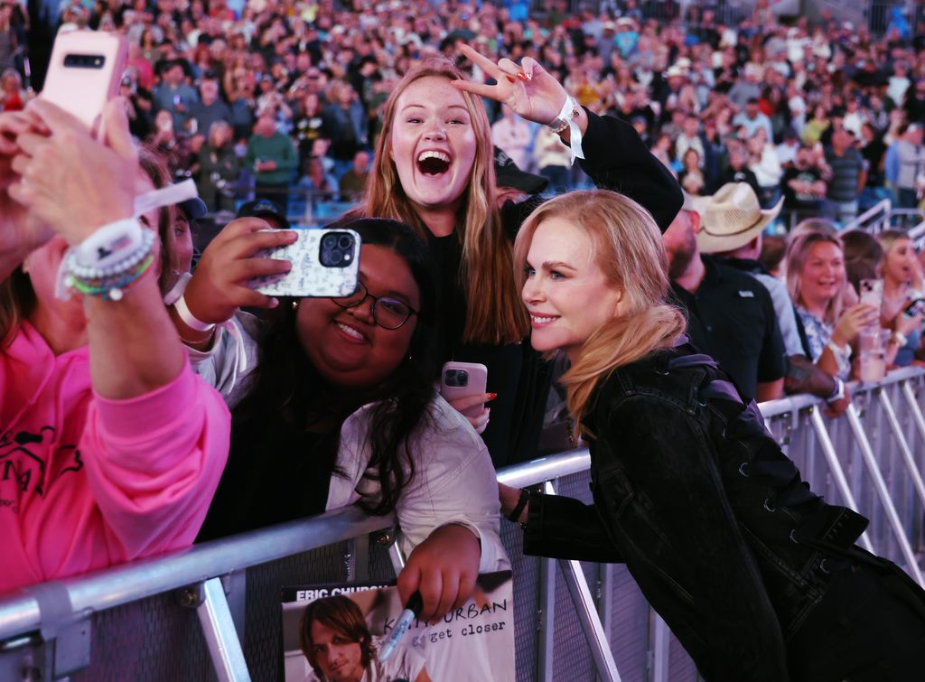 Nicole Kidman poses with fans at the Concert For Carolina Benefit Concert at Bank of America Stadium on October 26, 2024 in Charlotte, North Carolina.