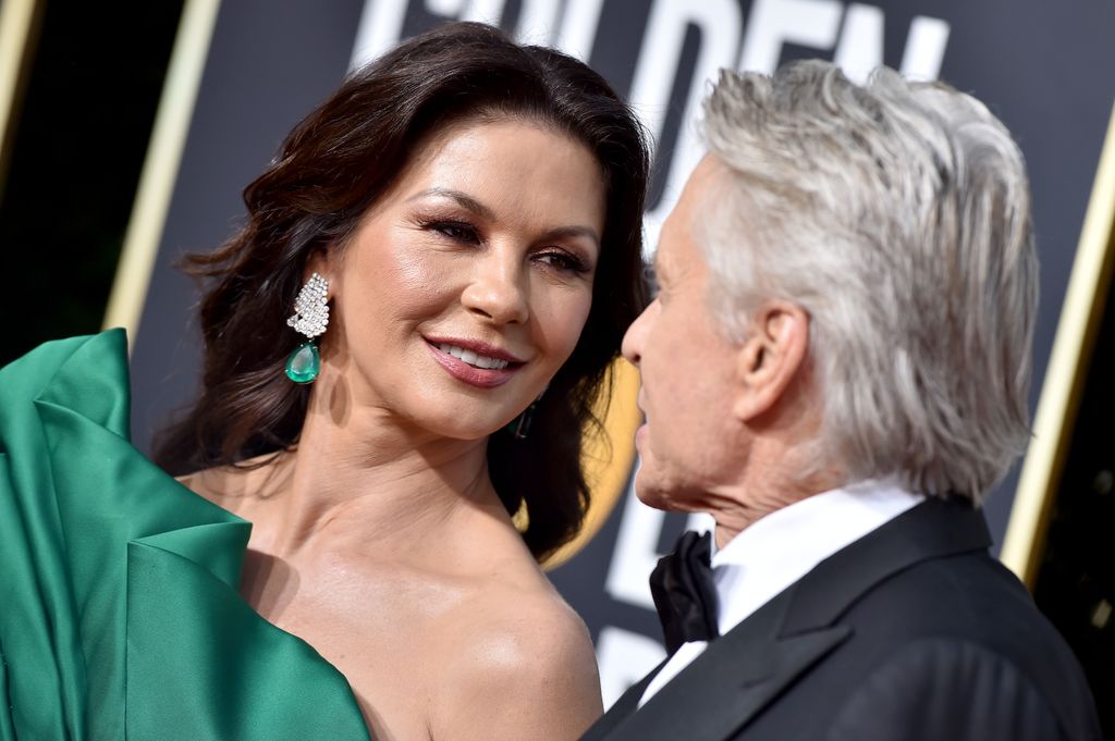 couple looking at each other on red carpet