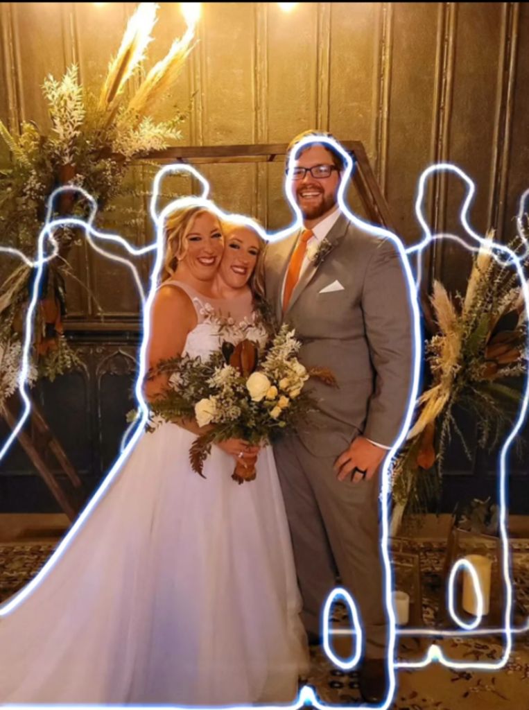 Abby and Brittany Henshall pose with Abby's husband Josh at their wedding