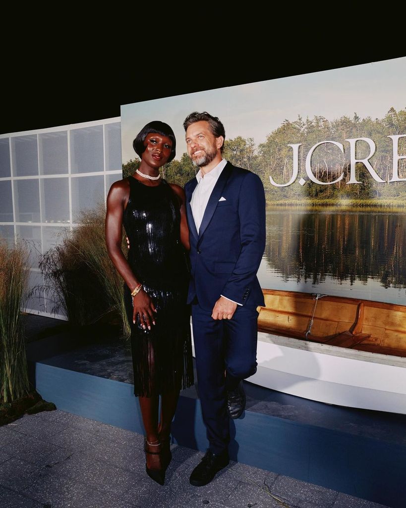 Jodie Turner Smith in a black dress with Joshua Jackson