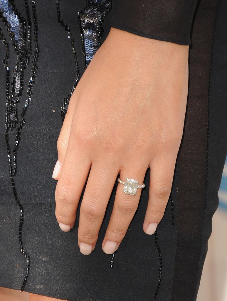 chrissy teigen hand with diamond ring