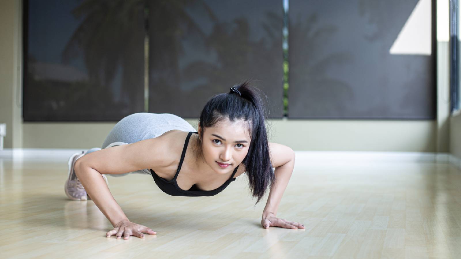 A woman doing a push up