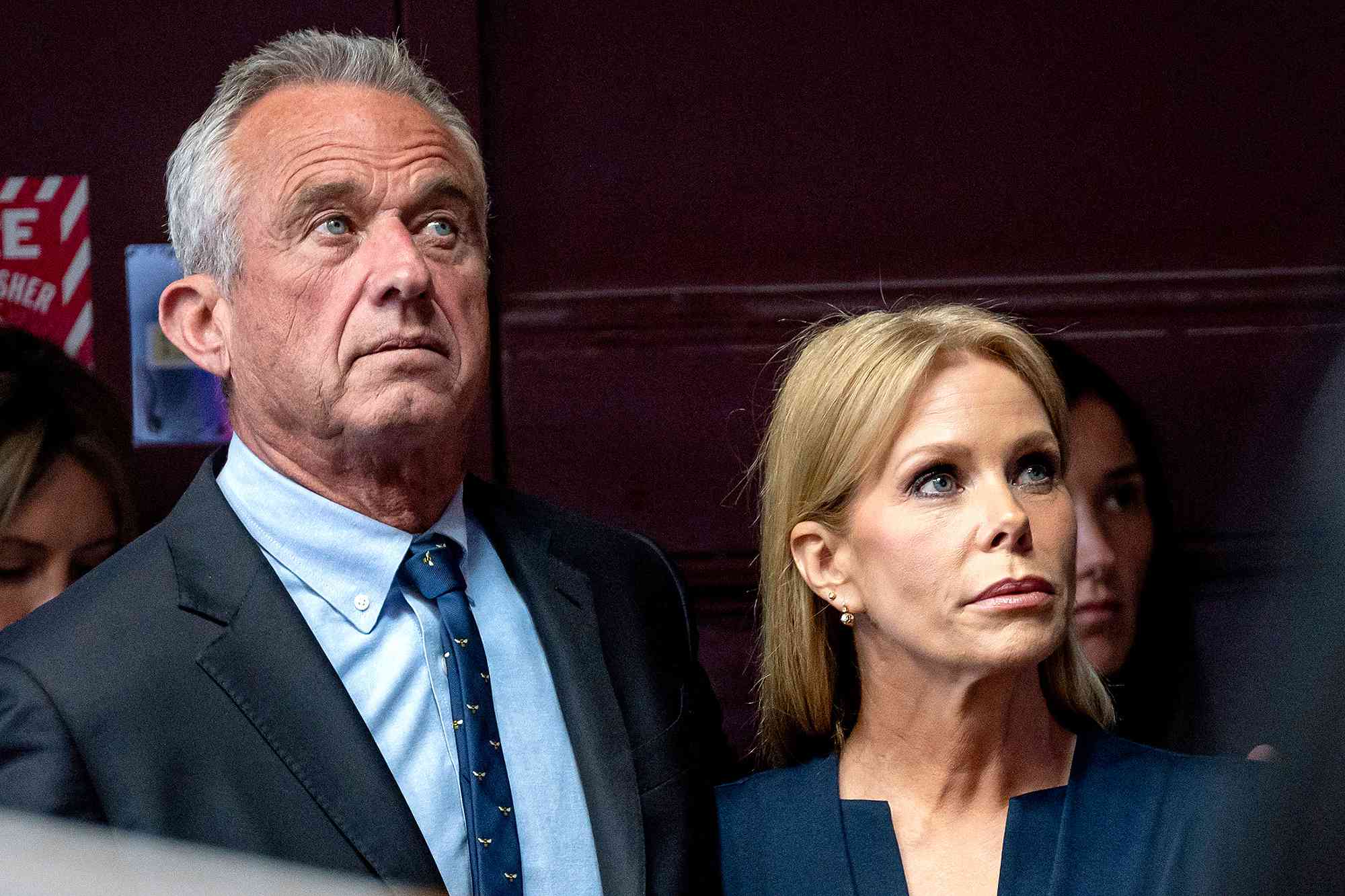 Robert F. Kennedy Jr., partner with Morgan & Morgan PA and 2024 independent presidential candidate, left, and his wife actress Cheryl Hines, right, during a campaign event in Oakland, California, US, on Tuesday, March 26, 2024