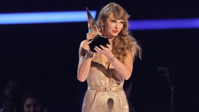 Taylor Swift accepts the Artist of the Year award during the 2022 American Music Awards in Los Angeles, California.