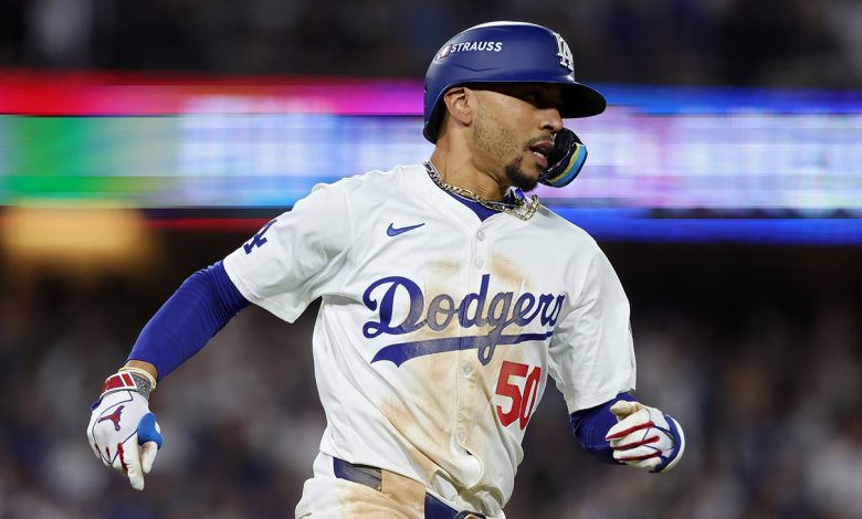 Mookie Betts 50 of the Los Angeles Dodgers reacts after hitting a double during the 8th inning of Game Six of the National League Championship Series against the New York Mets at Dodger Stadium on October 20, 2024 in Los Angeles, California.