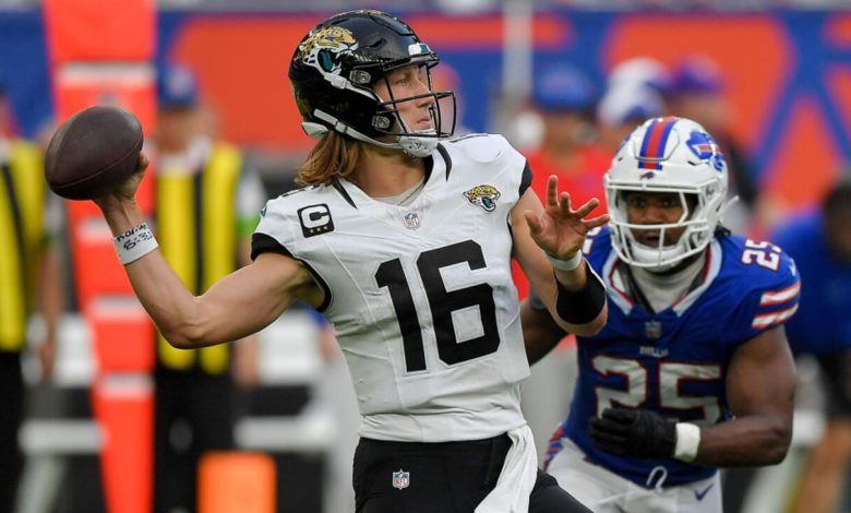 LONDON, ENGLAND - OCTOBER 8: Trevor Lawrence of Jacksonville Jaguars controls the ball during the NFL match between Jacksonville Jaguars and Buffalo Bills at Tottenham Hotspur Stadium on October 8, 2023 in London, England. (Photo by Vincent Mignott/DeFodi Images via Getty Images)