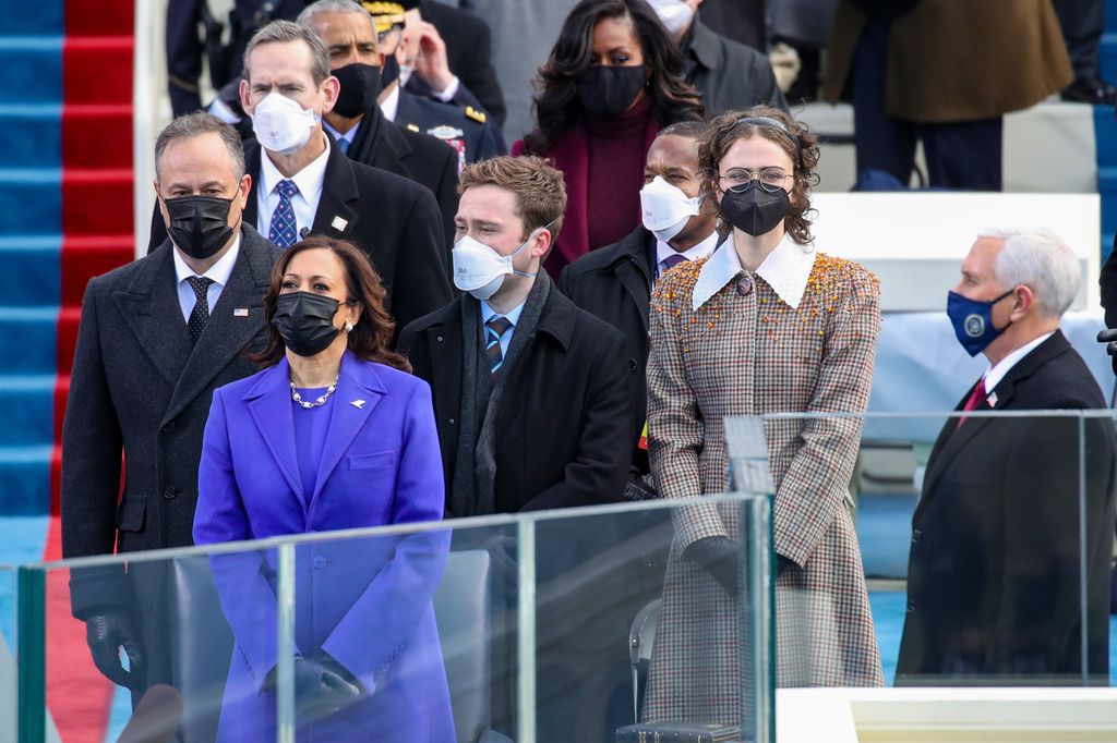 Doug Emhoff (from left), Vice President Kamala Harris, Cole Emhoff and Ella Emhoff stand as Lady Gaga sings the National Anthem at the inauguration of U.S. President-elect Joe Biden