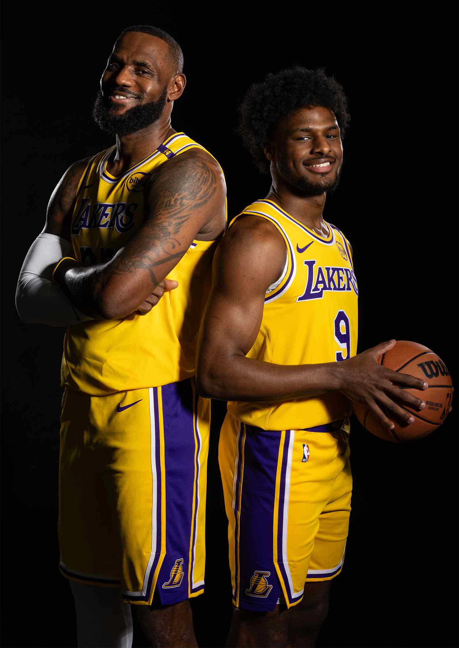 LeBron James #23 and Bronny James #9 of the Los Angeles Lakers pose for a portrait during NBA Media Day