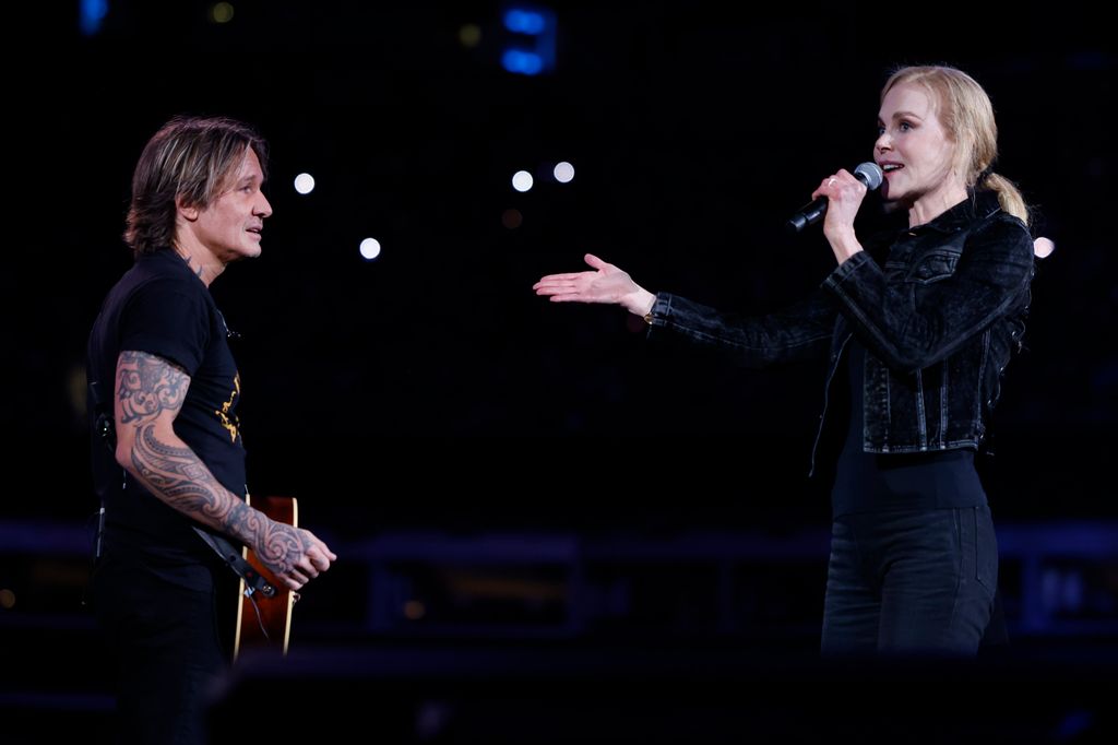 Keith Urban and Nicole Kidman speak onstage at the Concert For Carolina Benefit Concert at Bank of America Stadium on October 26, 2024 in Charlotte, North Carolina