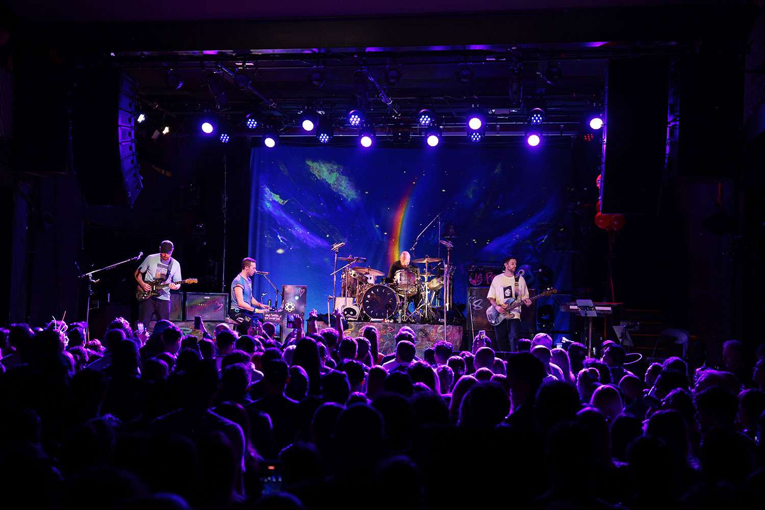 NEW YORK, NEW YORK - OCTOBER 07: (L-R) Jonny Buckland, Chris Martin, Will Champion and Guy Berryman of Coldplay perform onstage at 'SiriusXM presents Coldplay live in Brooklyn' at Music Hall of Williamsburg on October 07, 2024 in New York City.