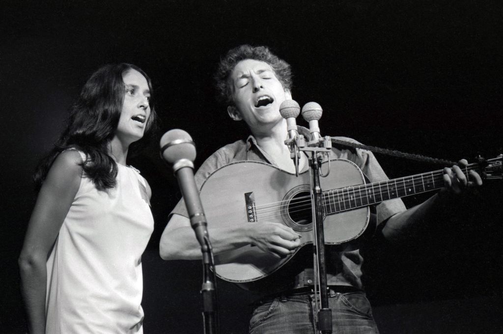 Bob Dylan is accompanied by American folk singer Joan Baez during Dylan's iconic performance at the 1963 Newport Folk Festival on July 26, 1963, in Newport, Rhode Island.