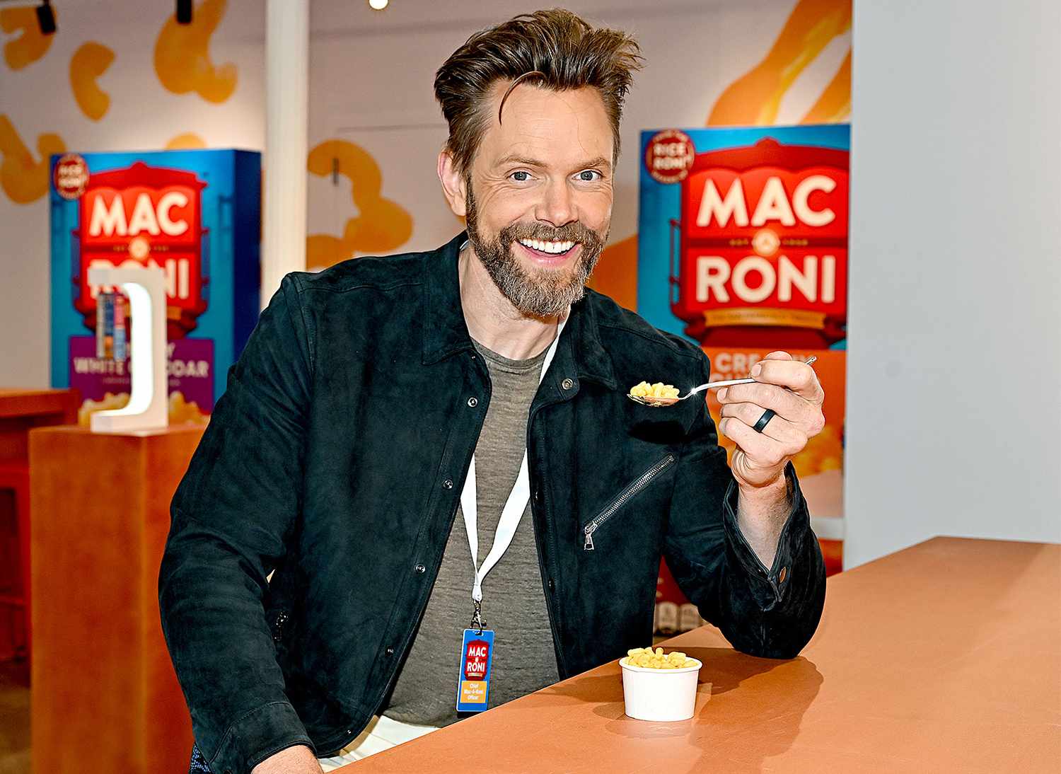 Joel McHale takes on the role of Chief Mac-A-Roni Officer at the Mac-A-Roni Experience in New York City