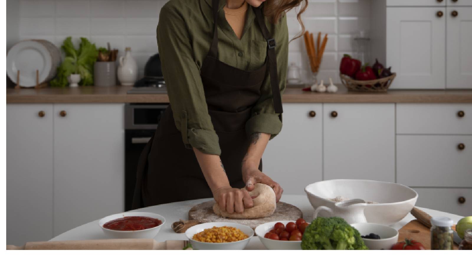 A woman kneading dough