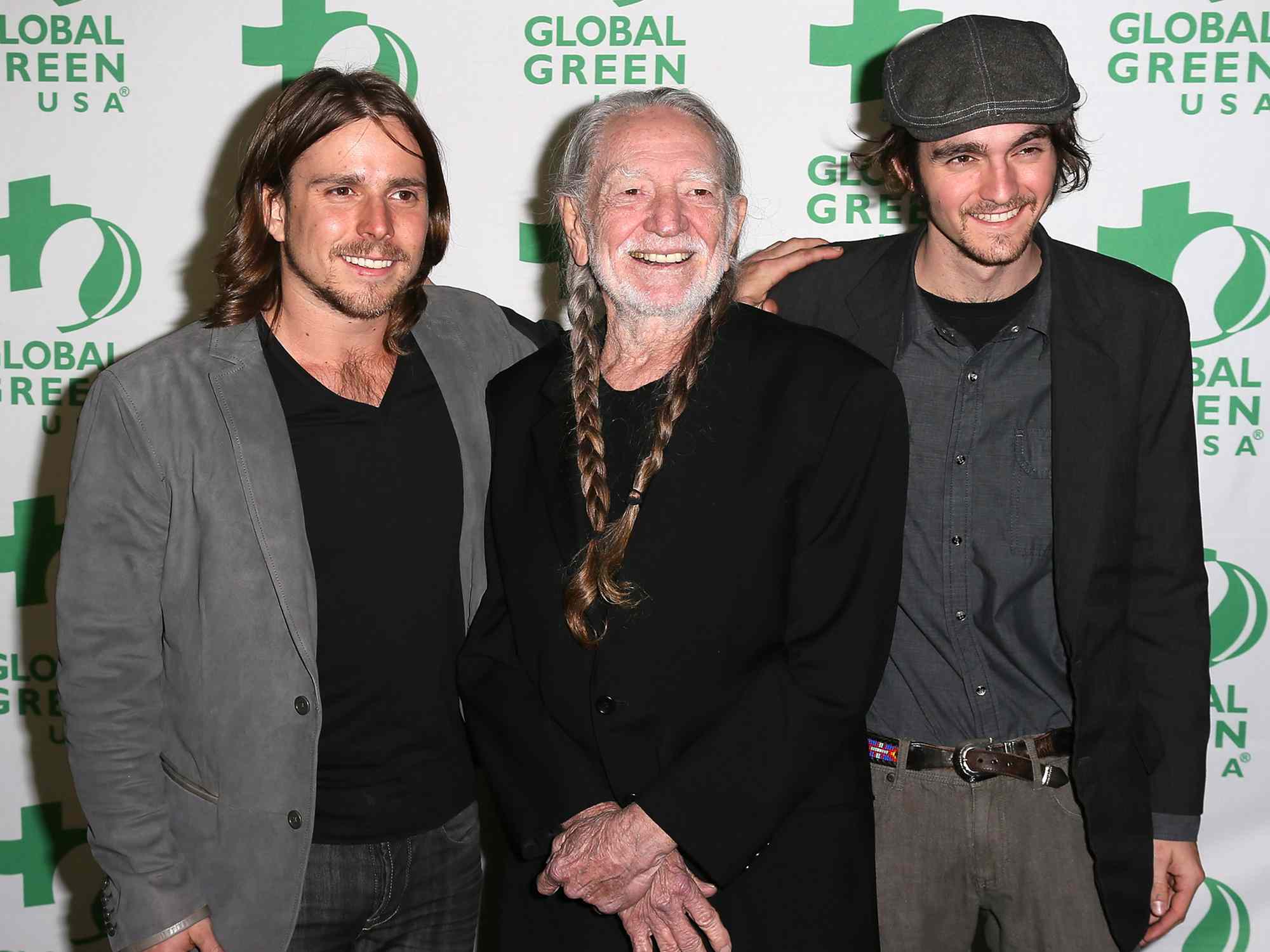 Willie Nelson (C) poses with sons Lucas Autry Nelson (L) and Jacob Micah Nelson (R) at Global Green USA's 10th Annual Pre-Oscar Party at Avalon on February 20, 2013 in Hollywood, California.