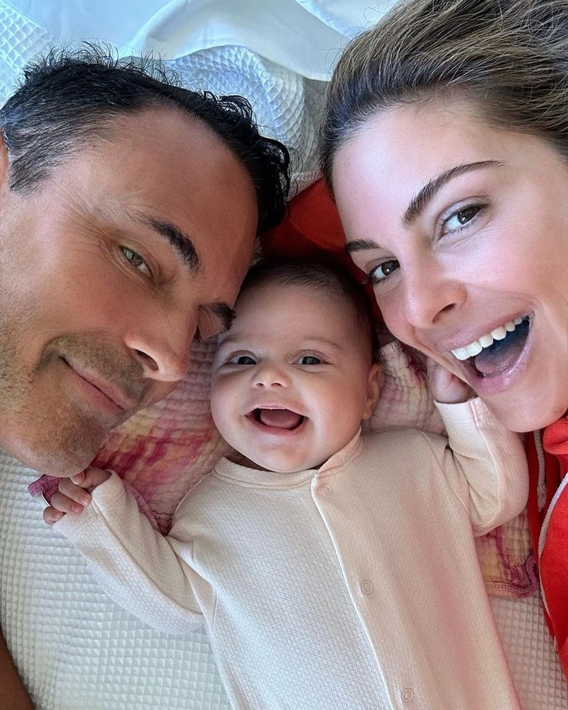 Maria Menounos and Keven Undergaro cozy up to baby Athena