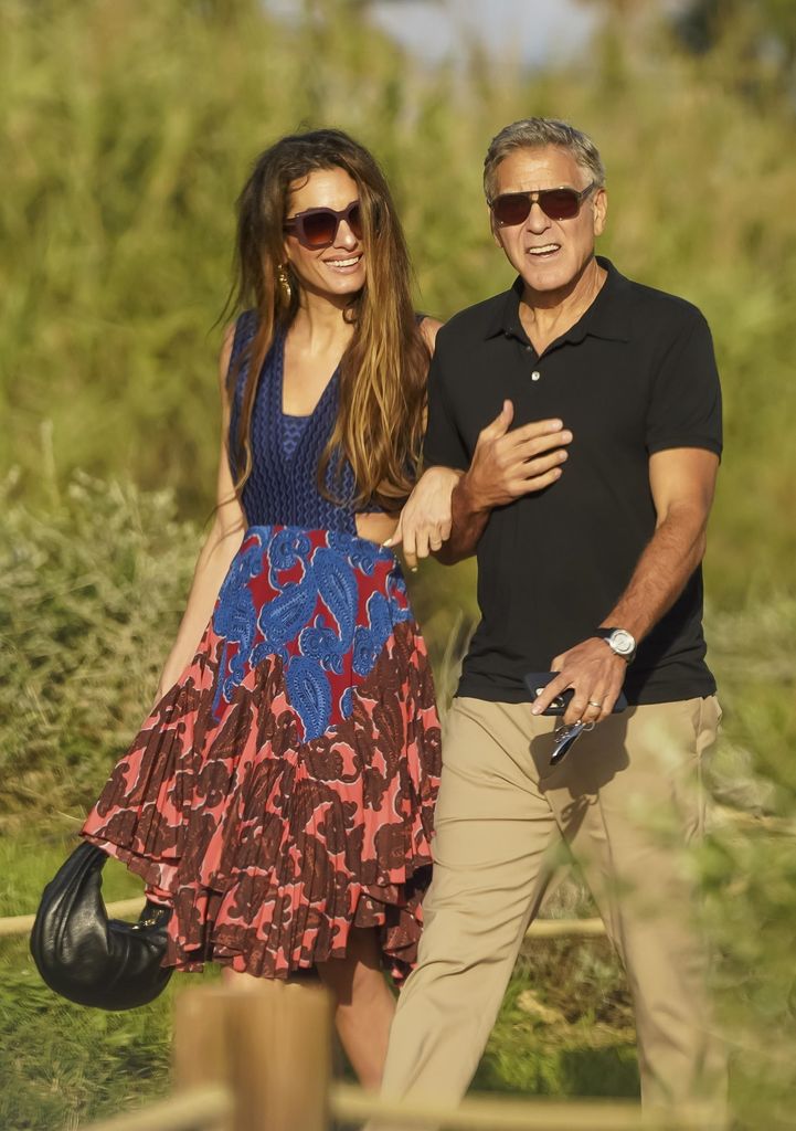 George Clooney and his wife Amal seen walking to La Cabane Bambou on Pampelonne Beach