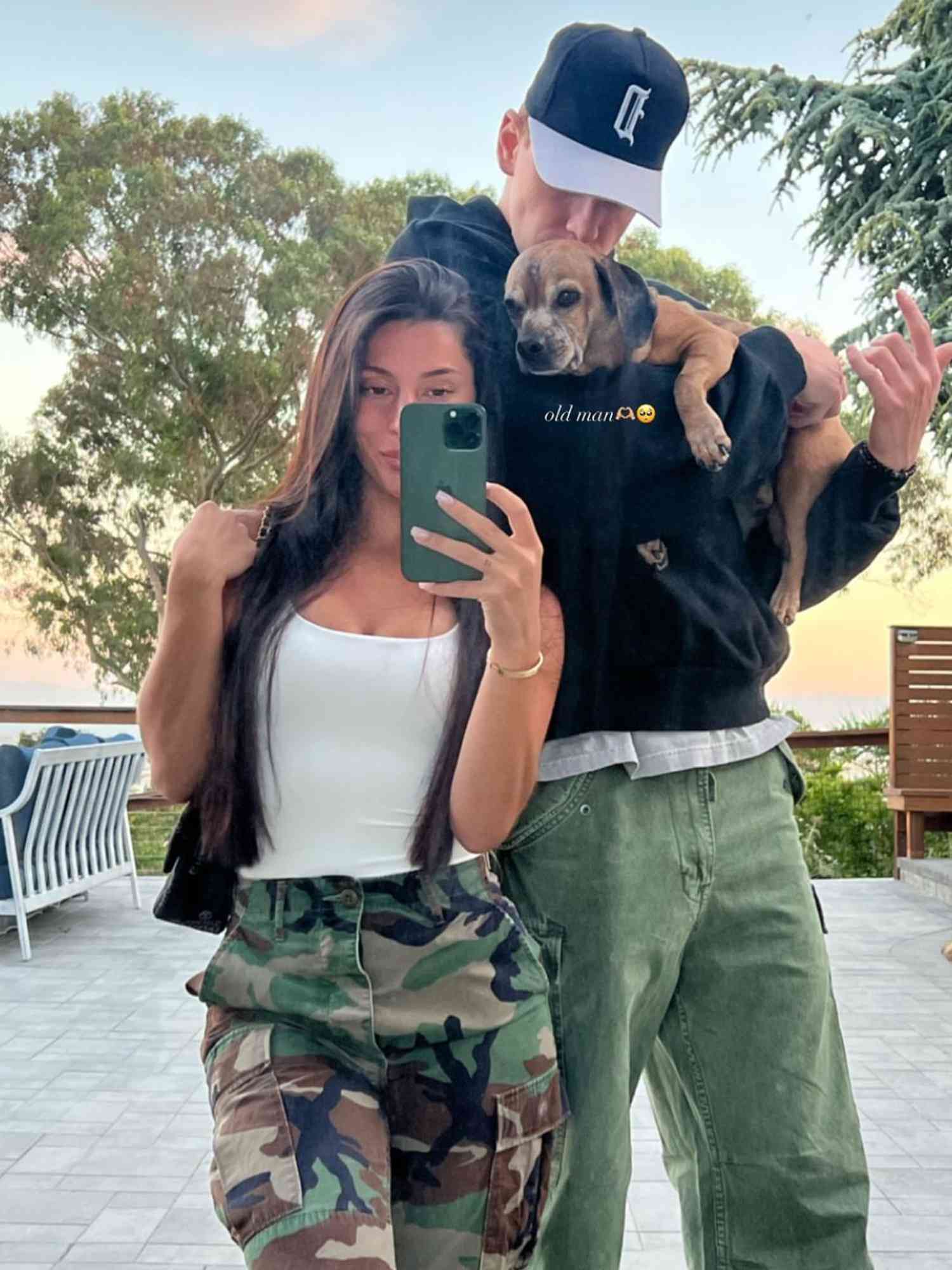 Donte DiVincenzo and Morgan Calantoni take a selfie with her dog.