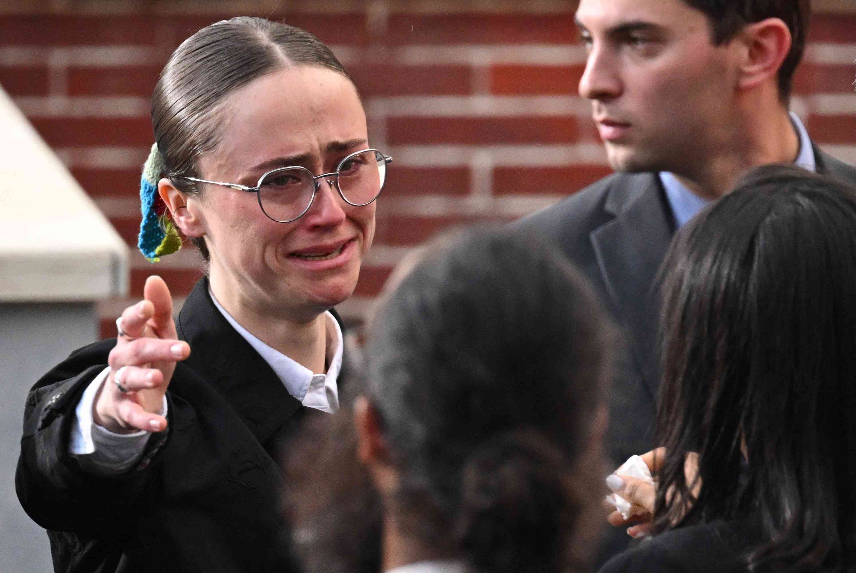 Ella Emhoff gets emotional as she reaches to hug someone after US Vice President Democratic presidential candidate Kamala Harris spoke at Howard University in Washington, DC, on November 6, 2024. Donald Trump won a sweeping victory on November 6, 2024 in the US presidential election, defeating Kamala Harris to complete an astonishing political comeback that sent shock waves around the world