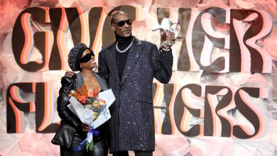 Shante Broadus and Snoop Dogg accept an award onstage at the 2024 Give Her FlowHers presented by Live Nation at The Beverly Hilton on Nov. 8.