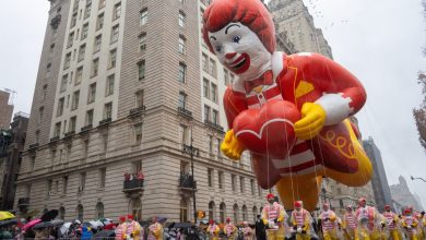 The Ronald McDonald balloon floats down the street during the annual Macy