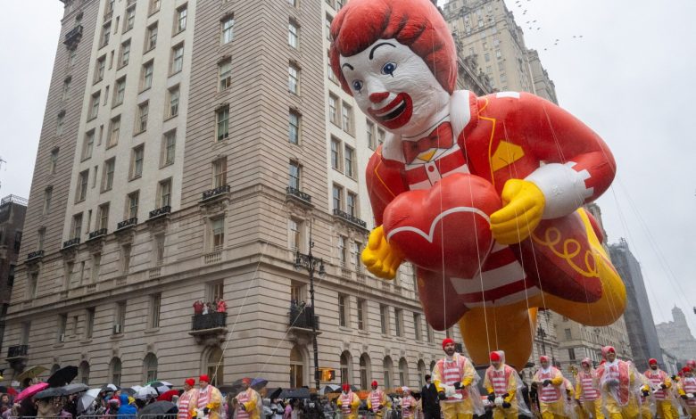 The Ronald McDonald balloon floats down the street during the annual Macy