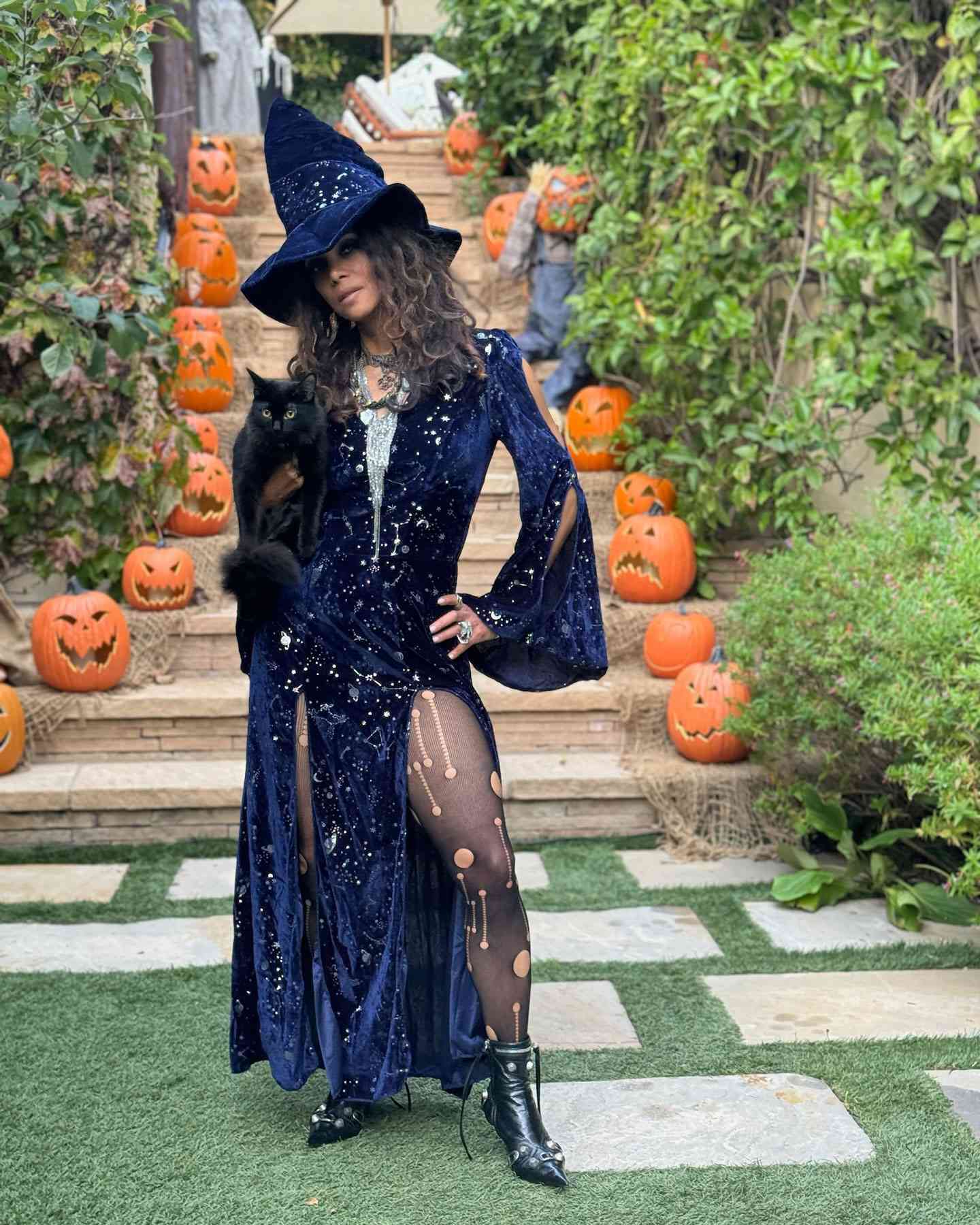 Halle Berry as witch with her cat Celebrity halloween costumes 2024