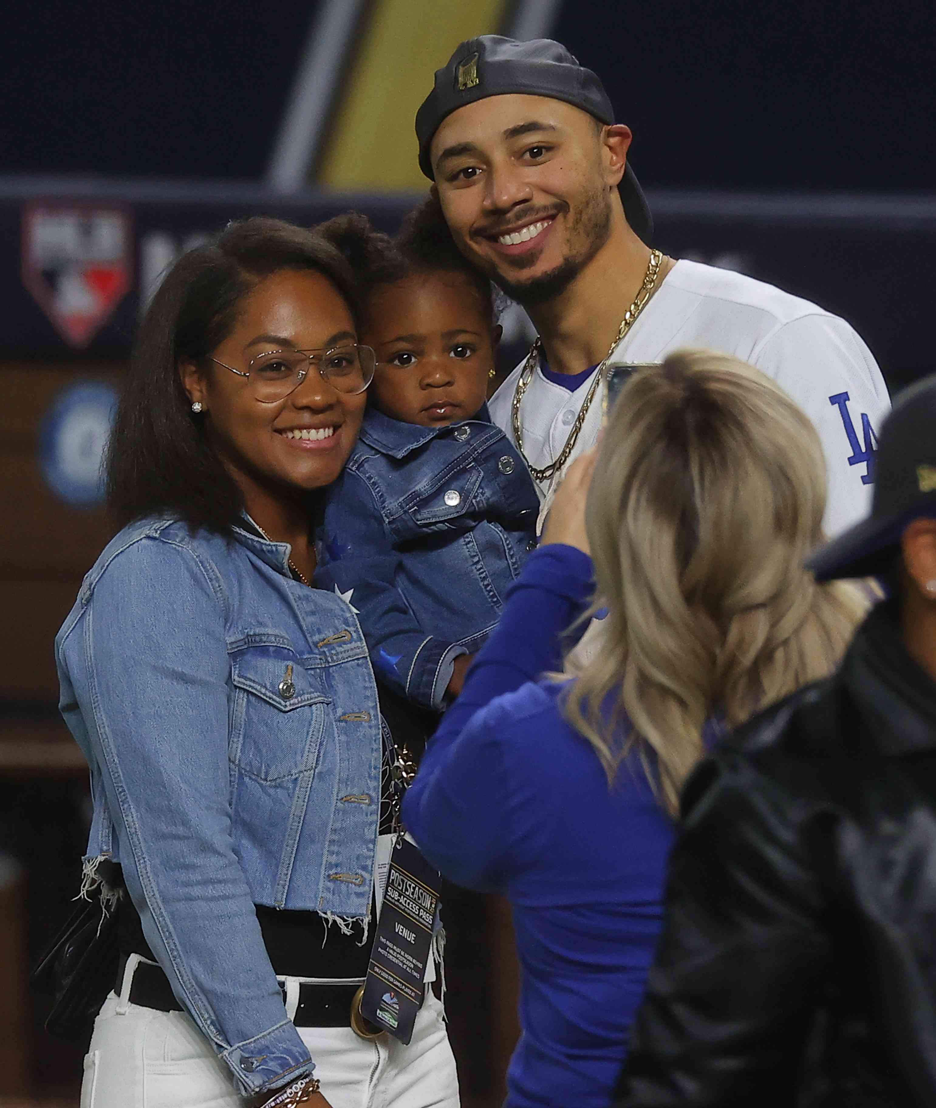 Mookie Betts #50 of the Los Angeles Dodgers celebrates with his wife, Brianna Hammonds and daughter Kynlee Ivory Betts after the teams 3-1 victory against the Tampa Bay Rays in Game Six to win the 2020 MLB World Series at Globe Life Field on October 27, 2020 in Arlington, Texas. 