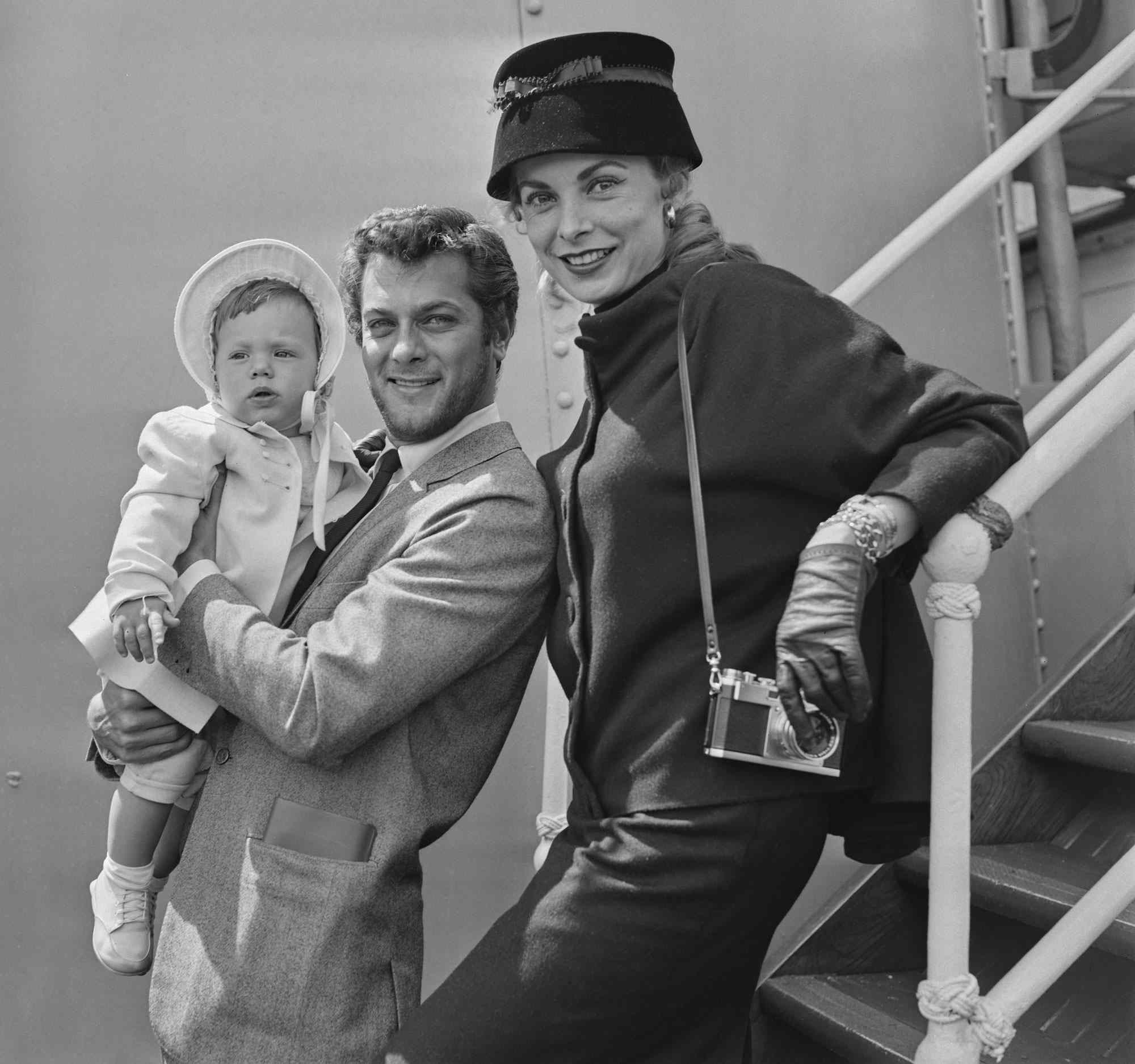 American actor Tony Curtis (1925 - 2010), his wife Janet Leigh (1927 - 2004) and their baby daughter Kelly aboard a passenger ship, England, June 19th 1957. (Photo by Evening Standard/Hulton Archive/Getty Images)