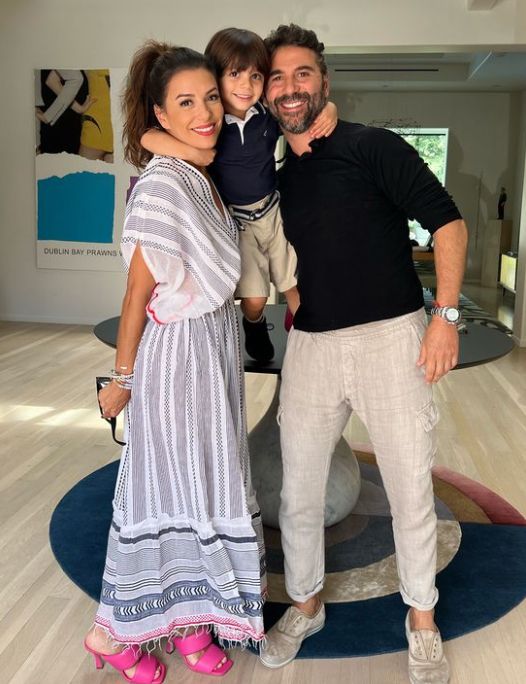 Eva Longoria and her husband with their son balancing between their heads