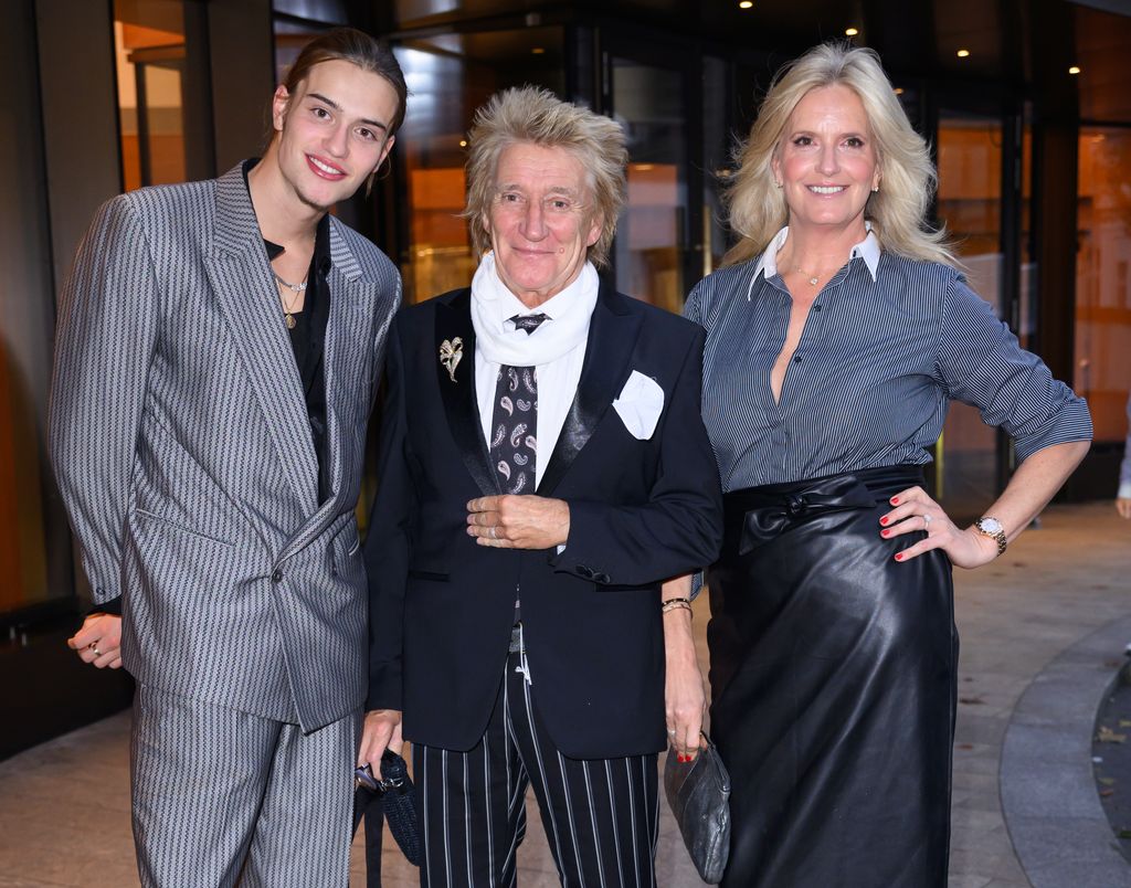 Alastair Wallace Stewart, Rod Stewart and Penny Lancaster pose in grey and black outfits