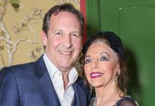 Joan Collins, 91, supported by besotted husband Percy in romantic moment