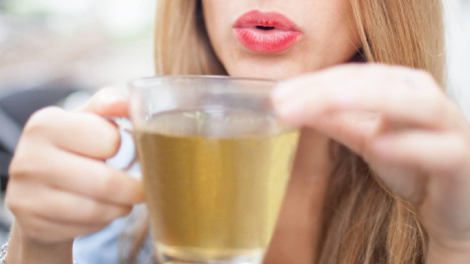 A woman drinking green tea